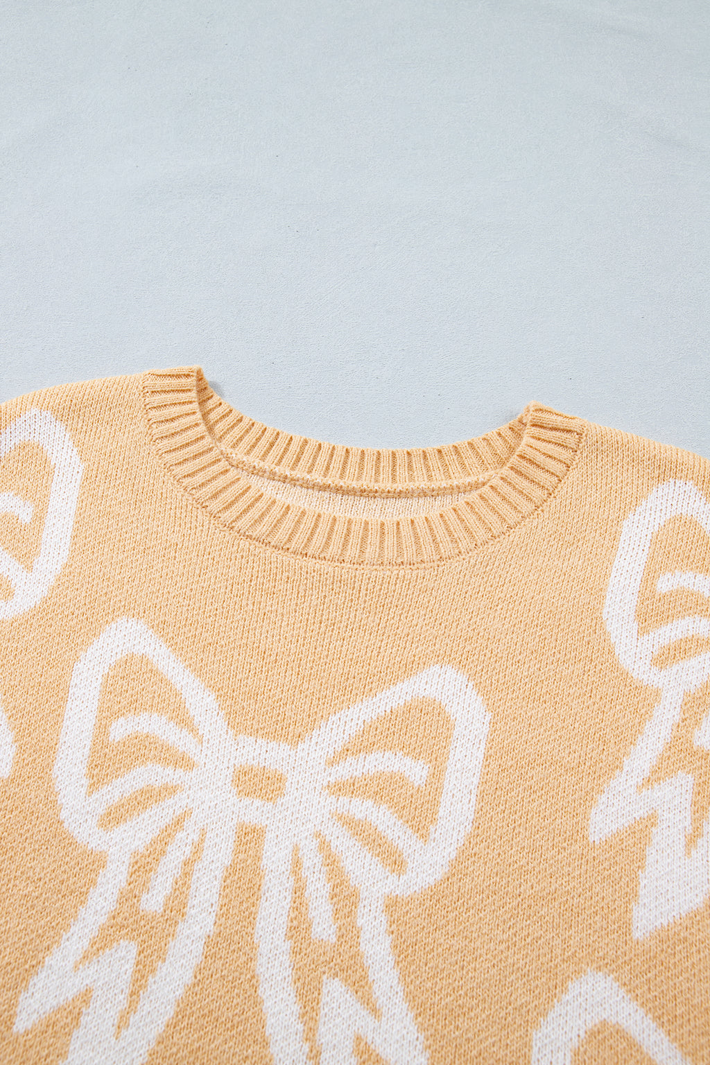 Golden Fleece Bow Pattern Drop Shoulder Loose Sweater